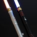 RAVEN - OLDREPUBLIC-Lightsaber With Premium Sound - In Hilt Recharging - Full RGB Color Spectrum - Heavy Dueling Capabiblity 
