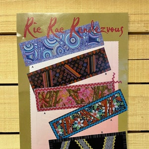 May include: A colorful fabric pattern guide for a quilting project called "Ric Rac Rendezvous" by Maple Island Quilts. The guide shows four different fabric patterns with the letters A and B to indicate different variations.