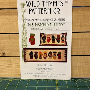 May include: A Wild Thymes Pattern Co. pattern sheet for "Mis-Matched Mittens." The sheet features a table runner design, measuring 16" x 17", and a pillow design, 17" x 32". The design includes various mitten illustrations.