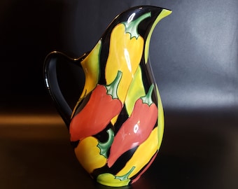 Vintage ceramic 64oz Clay Art Caliente Pitcher red yellow green peppers on black
