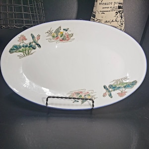 Vintage ceramic platter by JOJO, raised flower design 12 inches in length