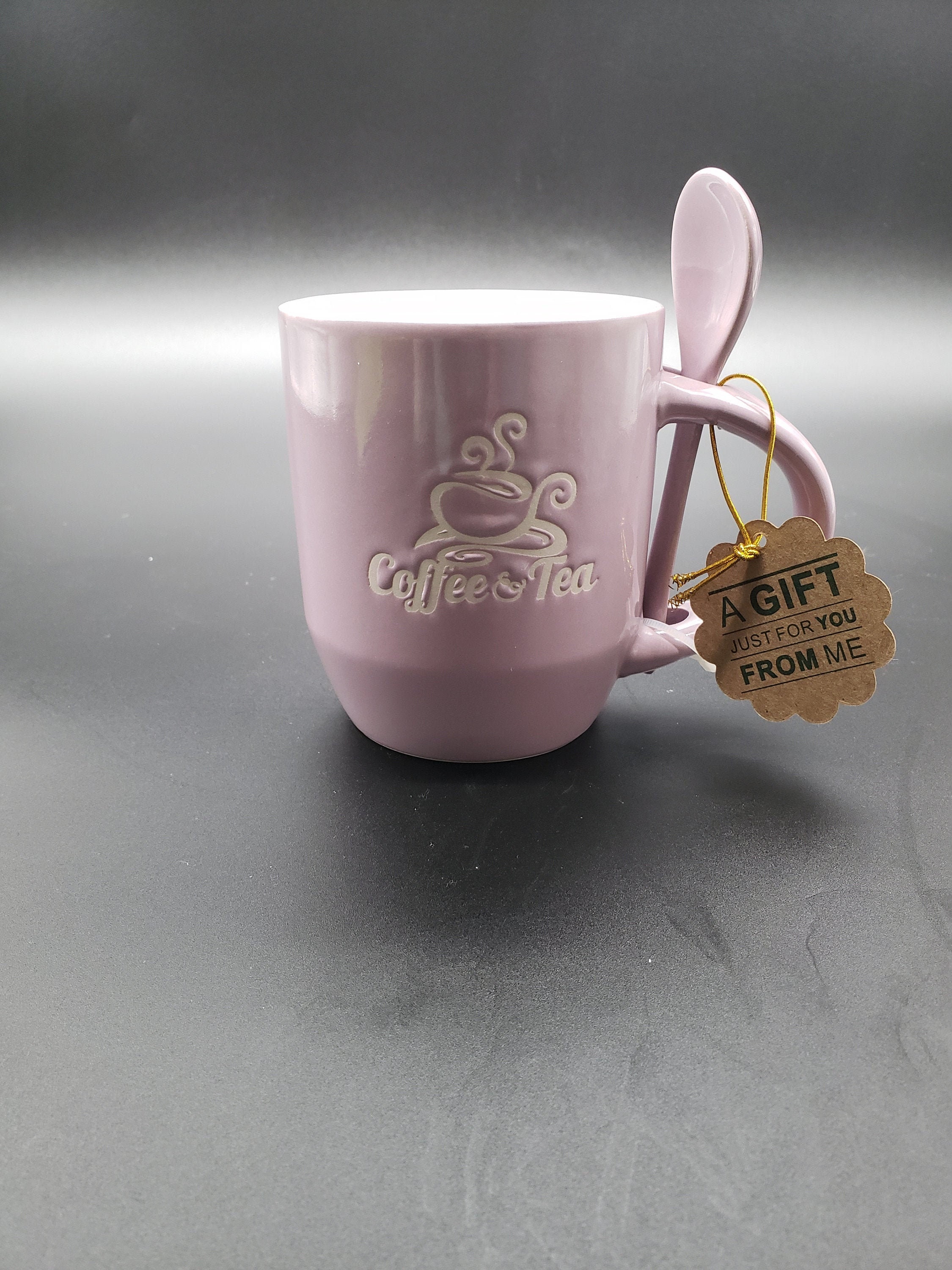 Cute ceramic mug with matching spoon