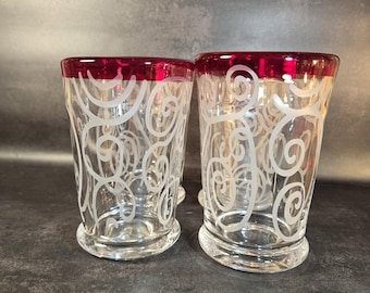 Vintage handblown glass tumblers , scrolling swirl pattern, red rim. Made in Italy