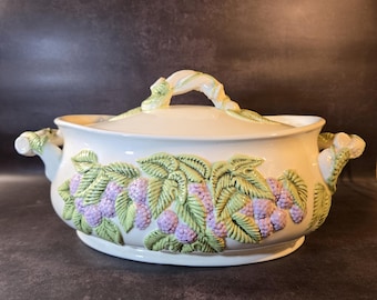 Vintage covered ceramic tureen with embossed grapes and leaves in a majolica style