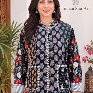 May include: A black quilted jacket featuring a multi-coloured floral block print pattern, a mandarin collar, and two front pockets. The jacket has white and black striped trim along the edges, cuffs, and pockets. Text reads: Made by Indian Star Art.