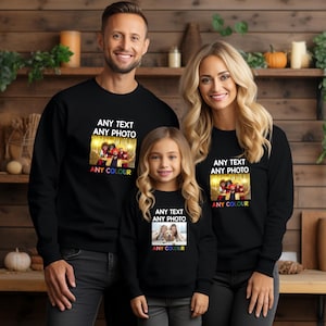 May include: Three black sweatshirts with a photo and text design. The text on the sweatshirts reads "Any Text Any Photo Any Colour".
