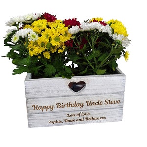 May include: A white-washed wooden planter box filled with yellow, white, and red chrysanthemums. The box features a heart-shaped cut-out and the text "Happy Birthday Uncle Steve" with a personal message.