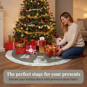 May include: A round grey Christmas tree skirt featuring a white snowman graphic with a black and white plaid scarf, surrounded by white tree silhouettes and snowflakes, finished with a wide white plush border trim around the circular edge.