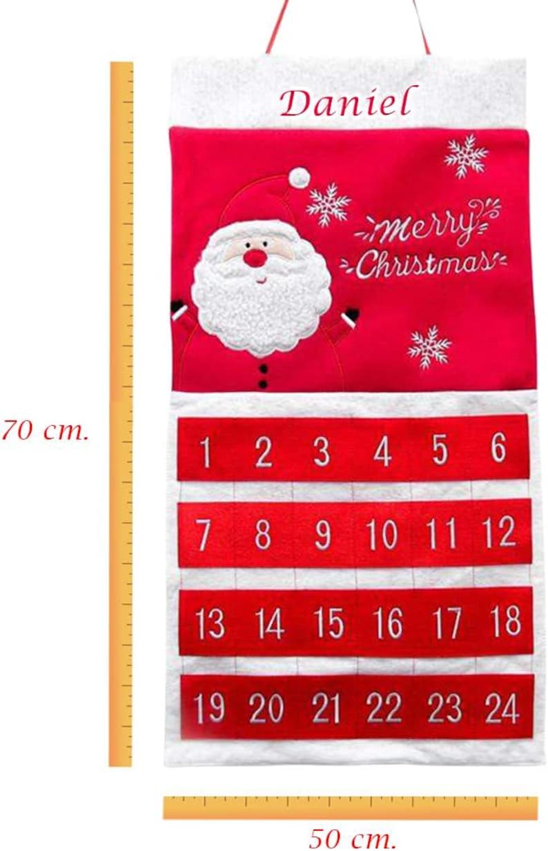 May include: Red and white Christmas advent calendar, 70 cm tall and 50 cm wide, with Santa Claus design and the words "merry Christmas". It has 24 numbered pockets for each day of December leading up to Christmas. The name "Daniel" is written at the top.