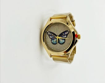 Ladies Gold Butterfly Watch: Rhinestone Bezel, Gold Tone Band