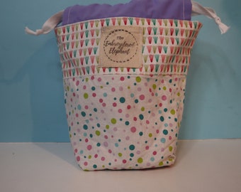 Multicoloured patterned project bag for knitting and crochet storage