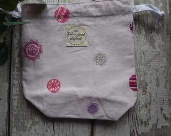 Simple lilac and pink mandala patterned sock project bag