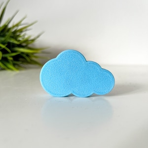 May include: A light blue cloud-shaped cutout, made of a textured material.