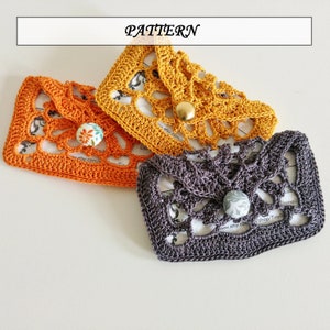 May include: Three crocheted card holders in orange, yellow, and gray with a button closure. The card holders are made with a delicate lace pattern and are perfect for holding business cards or gift cards.