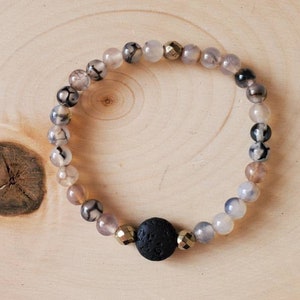 Handmade gemstone beaded bracelet with Banded Agate and a Lava Stone for aromatherapy. Healing bracelet.