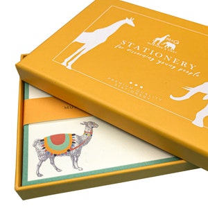 May include: A yellow box with the text "STATIONERY for discerning young people" and a white giraffe and elephant illustration. The box is open to reveal a stack of stationery cards with a llama illustration.