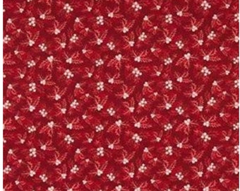 May include: Red fabric with a repeating pattern of white holly leaves and berries.