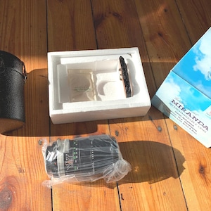 Brand new, original packaging and unused VINTAGE AUTO MIRANDA 135mm f2.8 portrait camera lens.