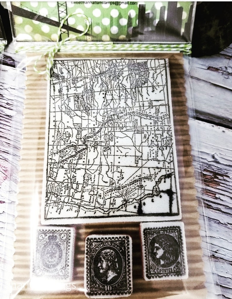 May include: A vintage map of a city with a black and white design. Three vintage postage stamps with black and white designs are below the map. The stamps feature portraits of people and the text "2 POSTES" and "10".