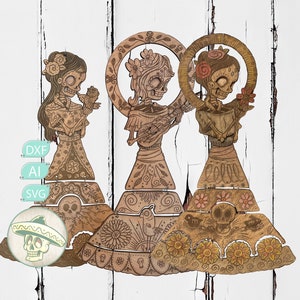May include: Three laser-cut wooden figures of skeletal characters in dresses, each featuring intricate floral and skull engravings. The figures are layered with articulated skirt sections. Text labels DXF, AI, and SVG are visible, along with a circular icon of a skull wearing a sombrero.