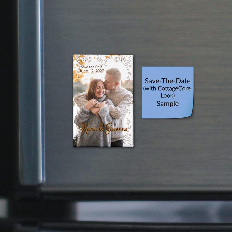 May include: A rectangular save-the-date magnet featuring a photograph of two people embracing, framed by a decorative border. The text reads Save the Date June 12, 2027 and Kevin & Susanne. Beside it is a blue square sticky note with black text.
