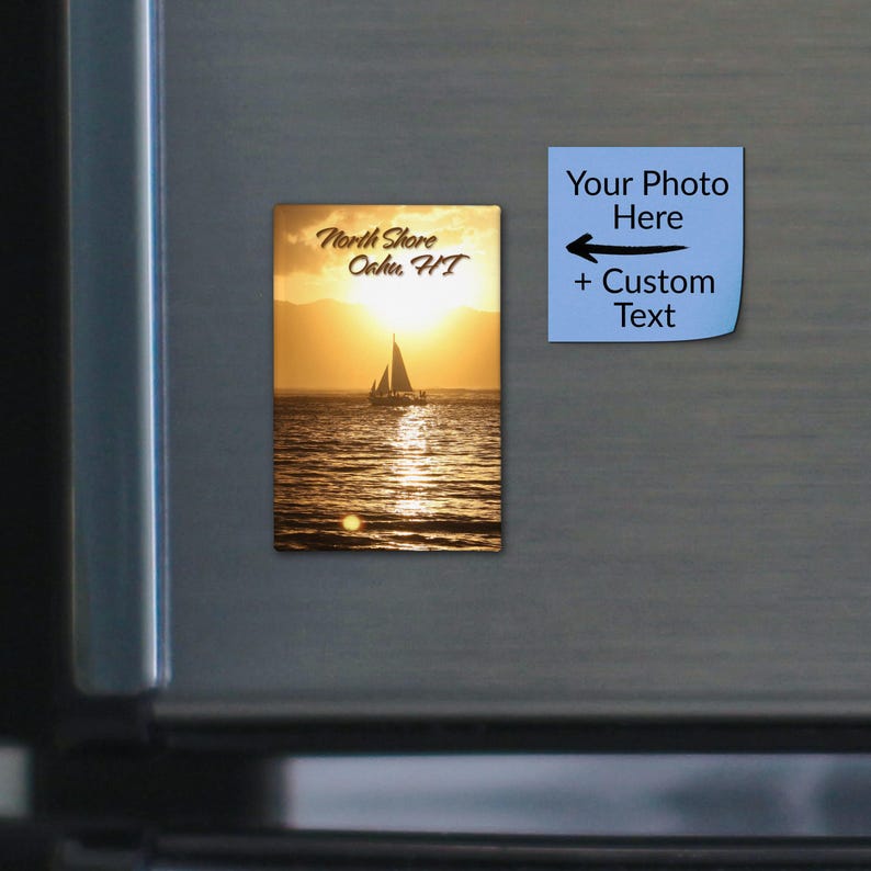 May include: A rectangular magnet featuring a sunset ocean scene with a sailboat silhouette and the text North Shore Oahu, HI. Beside it, a light blue square magnet displays the text Your Photo Here + Custom Text with a black arrow.