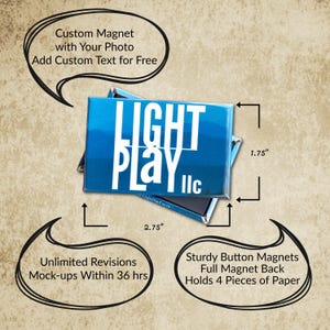 May include: A rectangular blue button magnet featuring the white text LIGHT PLAY llc. The magnet measures 2.75 inches by 1.75 inches and has a full magnetic back. The design includes a gradient blue background with a mountain silhouette graphic.