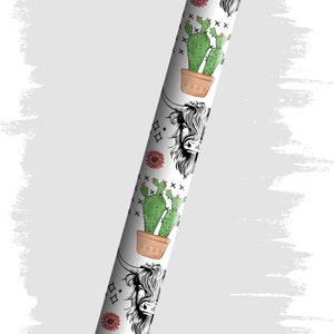 May include: A white pen with a black cap and a repeating pattern of potted cacti and a Highland cow's head.