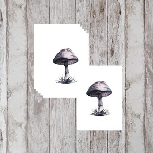 May include: Two printable sheets with a watercolor illustration of a purple mushroom on each sheet.
