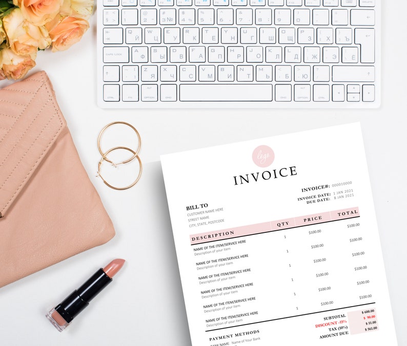 Invoice template laying next to nude purse, gold earrings and lipstick.
