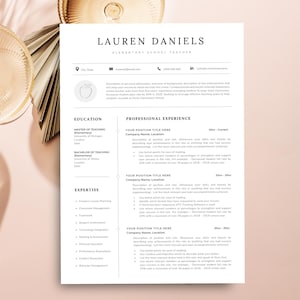 May include: A white resume template for an elementary school teacher named Lauren Daniels. The document features sections for education, professional experience, and expertise, with placeholder text and a small apple icon.