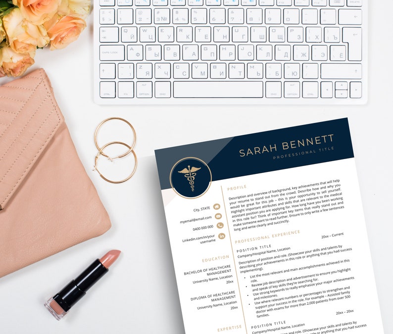 Resume template laying next to nude purse, gold earrings and lipstick.