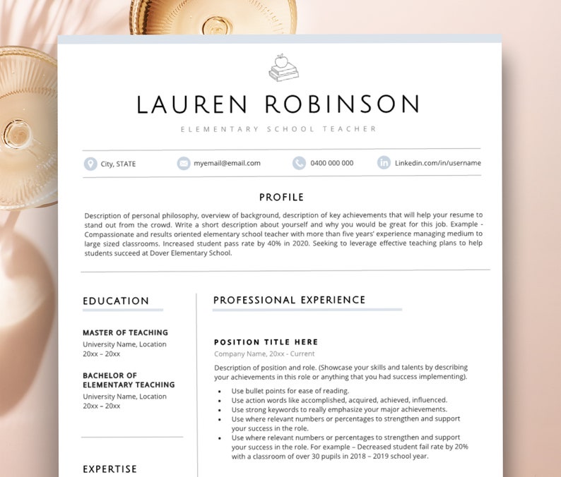 May include: A white resume template featuring a black text layout with sections for profile, education, and professional experience. The header includes the name Lauren Robinson, the title Elementary School Teacher, and a small line drawing of an apple on a stack of books.