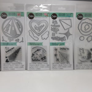 May include: Five sets of metal craft dies and clear stamps for scrapbooking and card making. The dies include a heart, a circle, a star, and a flower. The stamps include a heart, a circle, a star, and a flower. The stamps include the words "Sending Love", "Be My Valentine", "Sending You", and "Happy Birthday".