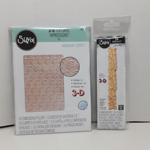 May include: Two Sizzix 3-D textured impressions embossing folders. One is A6 size with a geometric triangle pattern. The other is a die with a textured design. Both are in clear plastic packaging.