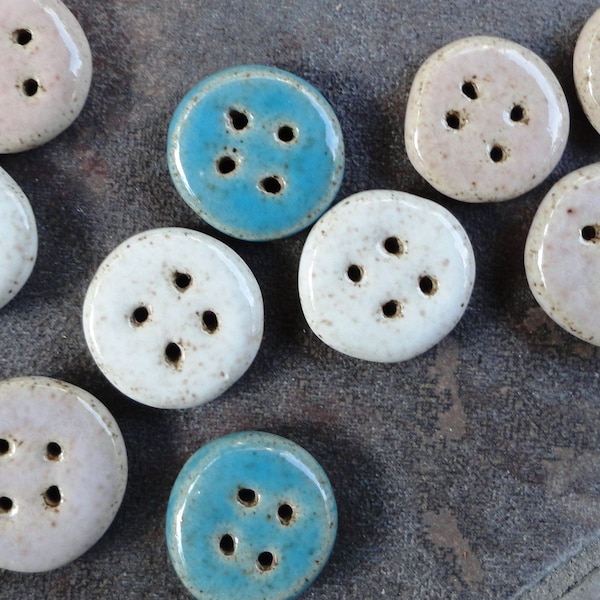 Homemade pottery clay buttons in colorful shapes, sizes, and colors.