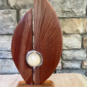 Hand carved, one of a kind contemporary sculpture