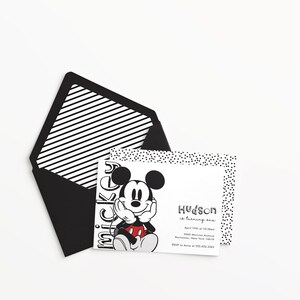 May include: Black and white invitation with a cartoon image of Mickey Mouse. The invitation says "Hudson is turning one" with the date, time, and location of the party. RSVP information is also included.