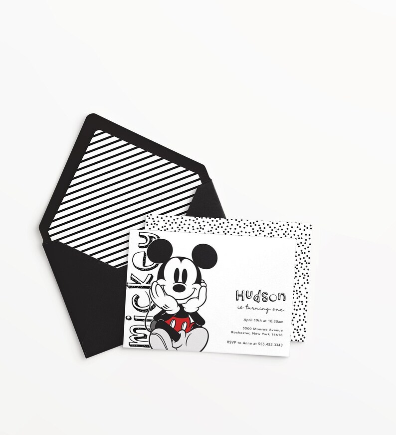 May include: Black and white invitation with a cartoon image of Mickey Mouse. The invitation says "Hudson is turning one" with the date, time, and location of the party. RSVP information is also included.