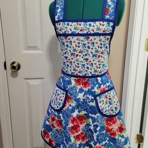 Vintage Style Apron with two coordinating Pioneer Woman fabrics and royal blue trim.