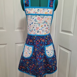 Vintage Style Apron with 2 different Pioneer Woman floral fabrics with blue trim.