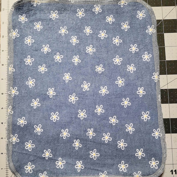 1 ply Cotton Flannel 12 x 10 inches unpaper towels or dish cloths with blue background and white flowers . Set of 10 in each package.