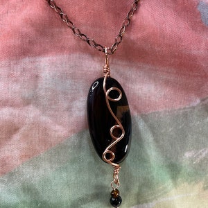 Black obsidian stone wrapped in copper earrings