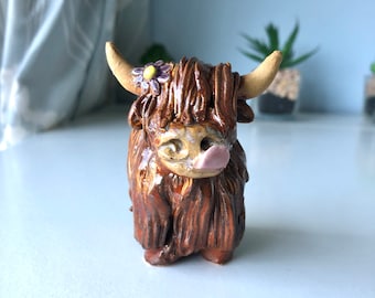 Hand made Highland cow with purple flower ornament