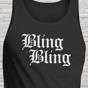 May include: Black tank top with the words "Bling Bling" printed in white in a gothic font.