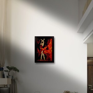 May include: A framed painting of a woman in a red dress with a fiery background. The painting is in a black frame and is hanging on a white wall.