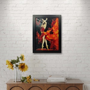 May include: A framed painting of a woman in a red dress dancing with a fiery background. The painting is set against a white brick wall.