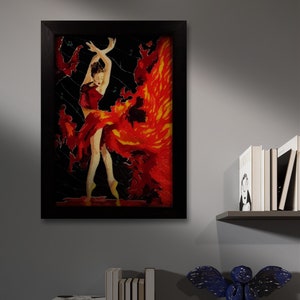 May include: A framed painting of a woman in a red dress with a fiery orange and yellow background. The woman is dancing with her arms raised above her head. The painting is set against a gray wall with a shelf of books and a blue angel figurine.