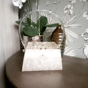 Vintage 1950s top handle lucite bag. Pearlised.