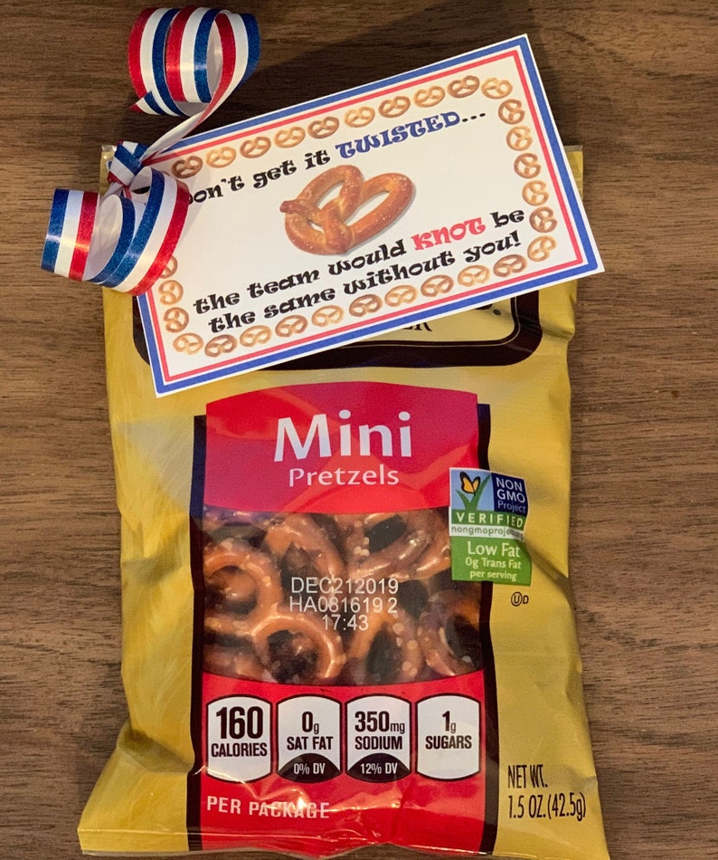 May include: A bag of mini pretzels with a red, white and blue ribbon and a card that says "Don't get it twisted... the team would knot be the same without you!"